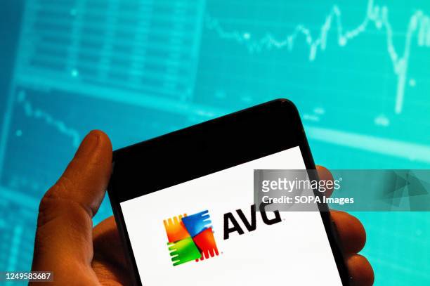 In this photo illustration, the antivirus software developed by AVG Technologies, AVG AntiVirus logo seen displayed on a smartphone with an economic...
