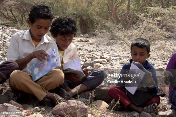 Children cross difficult roads to reach their schools by enduring the roughness of the mountains in Sabiha town of Lahij province of Aden, Yemen as...