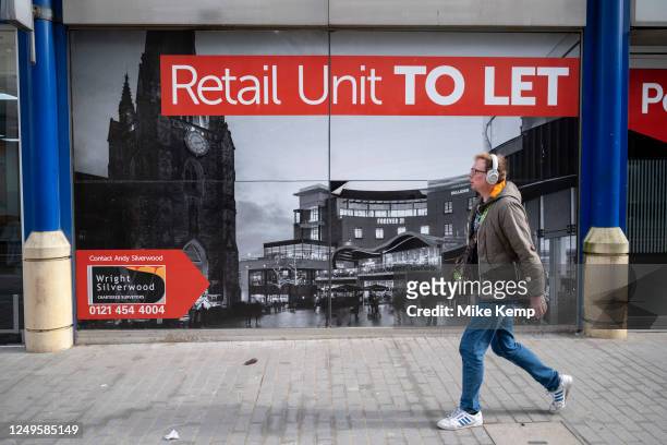 Closed down retail space boarded up and to let in the City Centre on 22nd March 2023 in Birmingham, United Kingdom. Things have been difficult for...