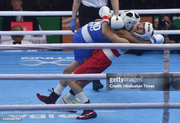 Indian boxer Nitu Ghanghas and Alua Balkibekova of Kazakhstan in-action during the Semi final match 2023 IBA Women's Boxing World Championships at IG...