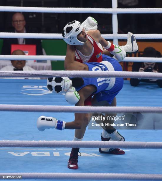Indian boxer Nitu Ghanghas and Alua Balkibekova of Kazakhstan in-action during the Semi final match 2023 IBA Women's Boxing World Championships at IG...