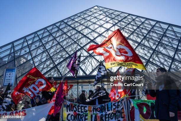 Striking union members stand on a picket line outside the Louvre Museum on March 27, 2023 in Paris, France. The country has experienced weeks of...