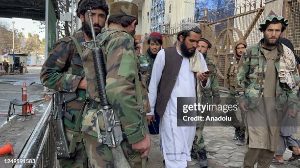 Security Forces guard near site which was damaged in a suicide bomb attack in Kabul, Afghanistan on March 27, 2023. A suicide bomber blew himself up...