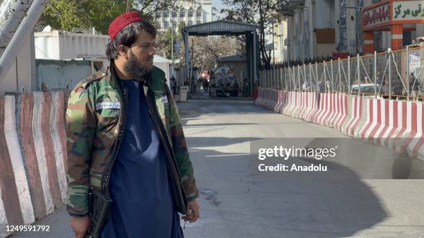 Security Forces guard near site which was damaged in a suicide bomb attack in Kabul, Afghanistan on March 27, 2023. A suicide bomber blew himself up...