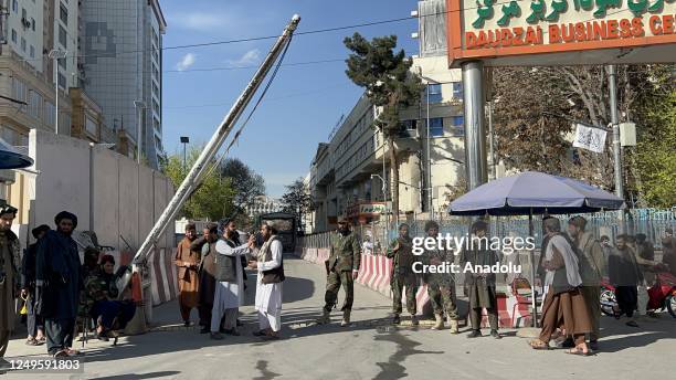 Security Forces guard near site which was damaged in a suicide bomb attack in Kabul, Afghanistan on March 27, 2023. A suicide bomber blew himself up...