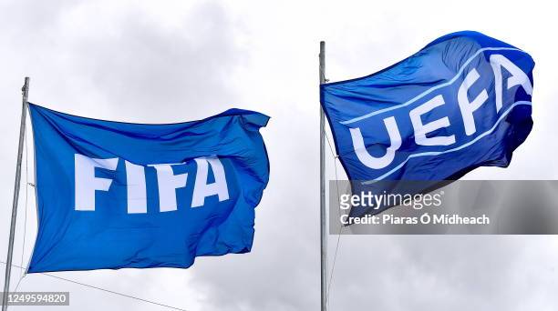 Wexford , Ireland - 22 March 2023; The FIFA and UEFA flags flying inside the ground before the UEFA European Under-19 Championship Elite Round match...