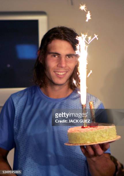 Rafael Nadal of Spain celebrates his 20th birthday during the French tennis Open at Roland Garros in Paris, 03 June 2006. AFP PHOTO JACK GUEZ