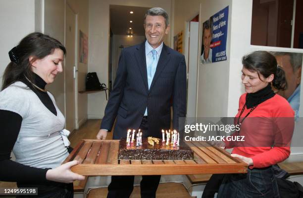 French far-right presidential candidate Philippe de Villiers smiles as he attends his birthday party at his campaign headquarters, 25 March 2007 in...