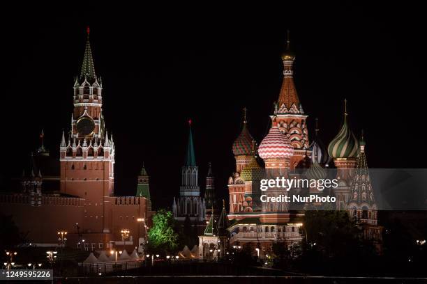 Saint Basil's Cathedral and Kremlin clock tower are seen in a night view in Moscow, Russia, on May 19, 2019.