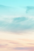 Vertical ratio size of sunset background. sky with soft and blur pastel colored clouds. gradient cloud on the beach resort. nature. sunrise.  peaceful morning.
