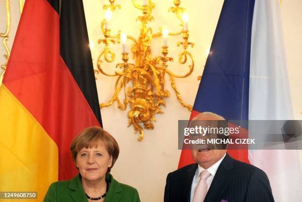 Czech President Vaclav Klaus and German Chancellor Angela Merkel pose on April 3, 2012 before their meeting at Prague Castle in Prague. AFP PHOTO /...