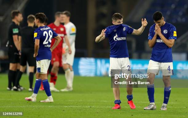 Jonjoe Kenny and Ozan Kabak of Schalke reacts after the Bundesliga match between FC Schalke 04 and Bayer 04 Leverkusen at Veltins-Arena on June 14,...