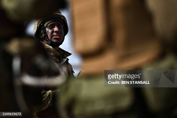 Ukraine Army recruits take instructions during a trench warfare training session with members of Britain's and New Zealand's armed forces personnel,...