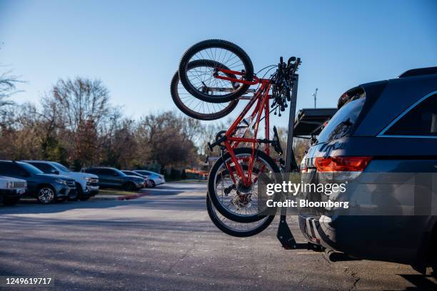 Bicycle rack on the back of an employee's vehicle in the parking lot of the Walmart campus in Bentonville, Arkansas, US, on Monday, Nov. 21, 2022. In...
