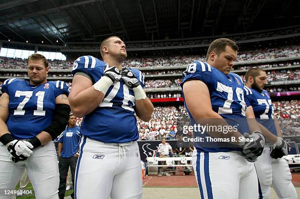 Ryan Diem, Joe Reitz, Mike Pollak and Jeff Linkenbach of the Indianapolis Colts pause for a moment of silence before the Colts played against the...