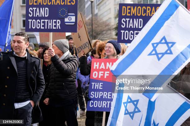 About 150 people demonstrate in Schuman roundabout, in the heart of the EU District on March 27, 2023 in Brussels, Belgium. Protestors said that:...