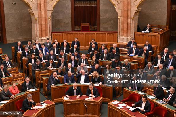 Hungarian Prime Minister Viktor Orban and deputy prime minister Zsolt Semjen attend the parliamenary session as the representatives of the Hungarian...