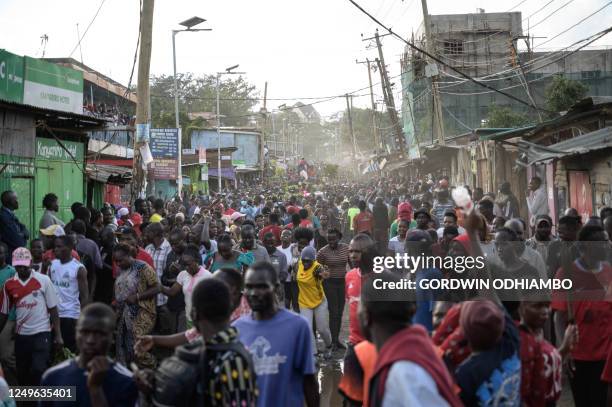 Protesters walk on the street during a rally called by the opposition leader Raila Odinga who claims the last Kenyan presidential election was stolen...