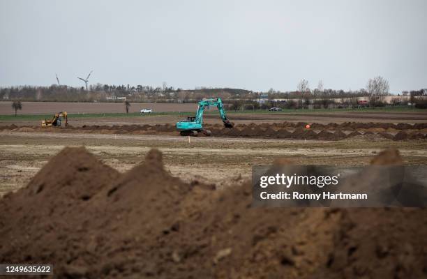 Excavators digging on an archeological excavation on the site of a planned new Intel chip factory on March 27, 2023 near Magdeburg, Germany. The new...