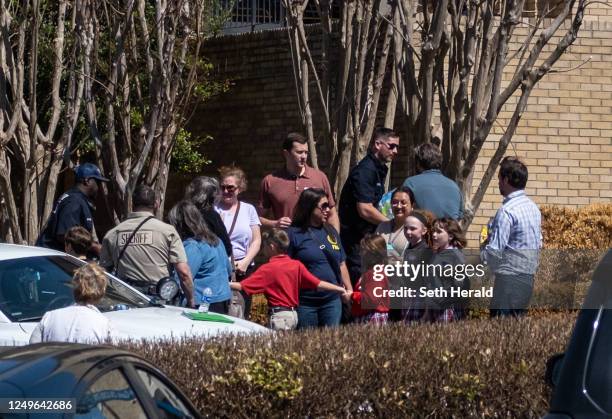 Children arrive at Woodmont Baptist Church to be reunited with their families after a mass shooting at The Covenant School on March 27, 2023 in...