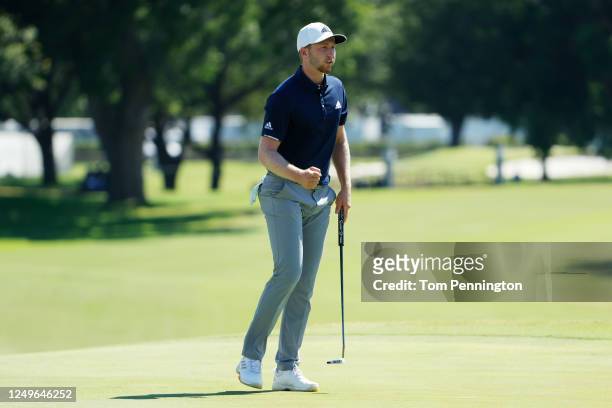 Daniel Berger of the United States reacts to his birdie on the 18th green during the final round of the Charles Schwab Challenge on June 14, 2020 at...