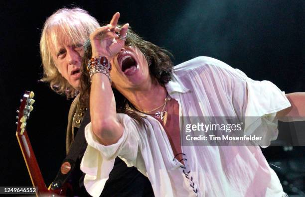 Brad Whitford and Steven Tyler of Aerosmith perform during the band's "Rocksimus Maximus" tour at Shoreline Amphitheatre on October 10, 2003 in...