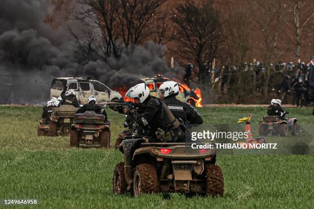 Riot mobile gendarmes, riding quad bikes, fire blast balls at demonstrators during a demonstration called by the collective "Bassines non merci", the...