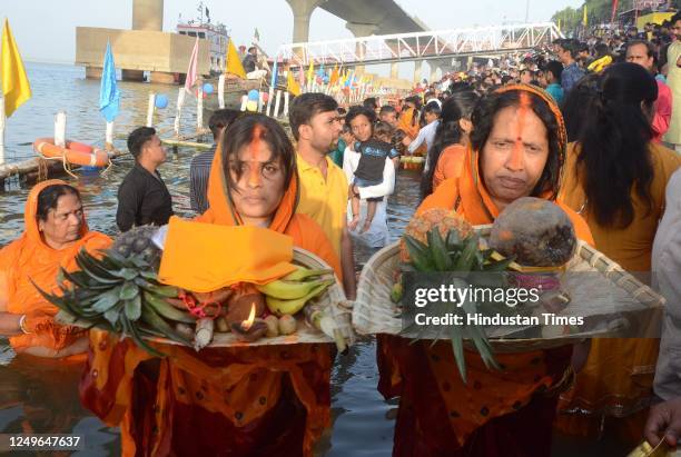 Chhath devotees perform rituals in Ganga river at Gandhi Ghat in Patna on the occasion of Chaiti Chhath Puja on March 27, 2023 in Patna, India.