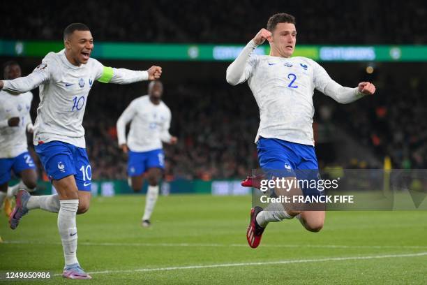 France's defender Benjamin Pavard celebrates with teammates after scoring the opening goal of the UEFA Euro 2024 group B qualification football match...