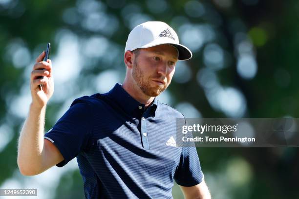 Daniel Berger of the United States celebrates defeating Collin Morikawa of the United States on the 17th green during a playoff to win in the final...