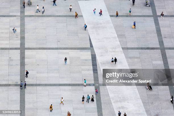 aerial view of people walking at the city square - people in crowd street imagens e fotografias de stock