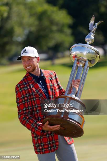 Daniel Berger of the United States celebrates with the plaid jacket and trophy after defeating Collin Morikawa of the United States in a playoff...