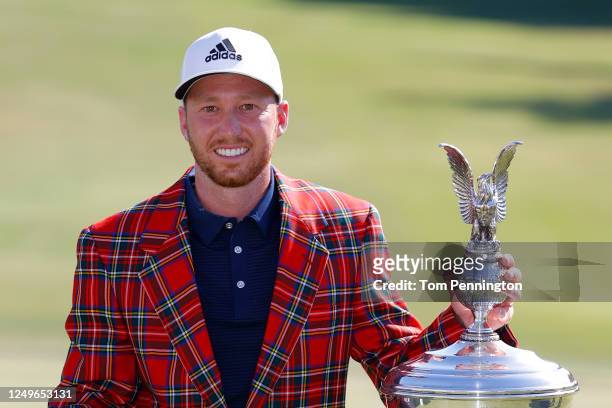 Daniel Berger of the United States celebrates with the plaid jacket and trophy after defeating Collin Morikawa of the United States in a playoff...