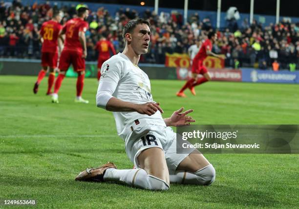 Dusan Vlahovic of Serbia celebrates after scoring a goal during the UEFA EURO 2024 qualifying round group B match between Montenegro and Serbia at...