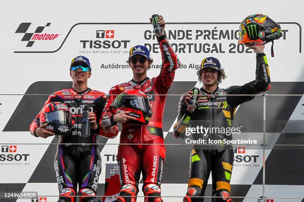 Maverick Vinales of Aprilia Racing, Francesco Bagnaia of Ducati Lenovo Team and Marco Bezzecchi of Mooney VR46 Racing Team celebrate on the podium...