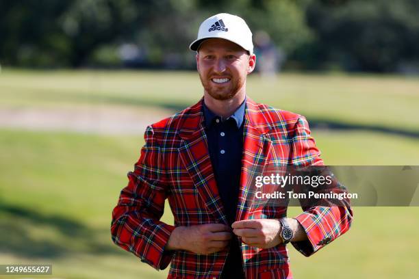 Daniel Berger of the United States puts on the plaid jacket as he celebrates winning after defeating Collin Morikawa of the United States in a...