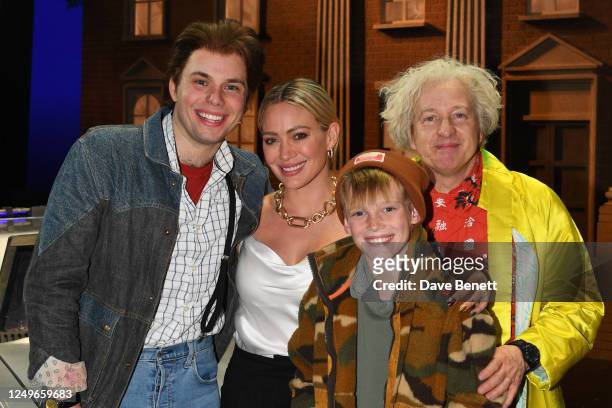 Will Haswell, Hilary Duff, son Luca Cruz Comrie and Cory English pose backstage with cast members at the West End production of "Back To The Future:...