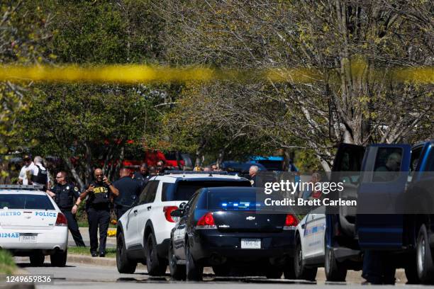 Police work near the scene of a mass shooting at the Covenant School on March 27, 2023 in Nashville, Tennessee. A 28-year-old former female student...