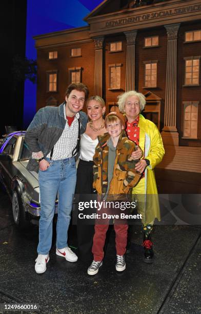 Will Haswell, Hilary Duff, son Luca Cruz Comrie and Cory English pose backstage with cast members at the West End production of "Back To The Future:...