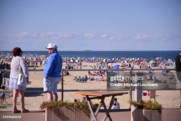 Crowds return to the boardwalk and beach at Pier Village on June 14, 2020 in Long Branch, New Jersey. New Jersey Governor Phil Murphy reopened...