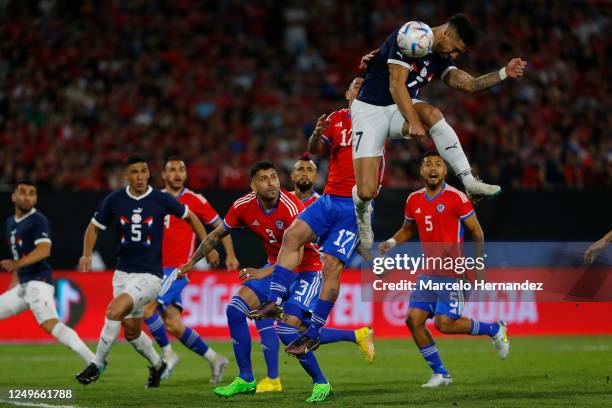 Gabriel Avalos of Paraguay and Gary Medel of Chile challenge for the ball during an international friendly match at Estadio Monumental David Arellano...