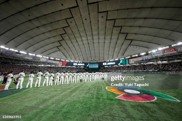 Members of Team Japan stand on the field prior to Game 4 of Pool B between Team Korea and Team Japan at Tokyo Dome on Friday, March 10, 2023 in...