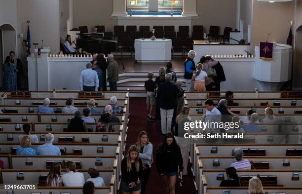 People attend a vigil at Woodmont Christian for those who were killed in a mass shooting at The Covenant School on March 27, 2023 in Nashville,...