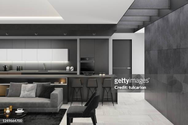 luxuriöses schwarzes wohnzimmer mit modernem minimalistischem italienischen stil offene küche mit großer langer kücheninsel. - table brick wall wood stock-fotos und bilder