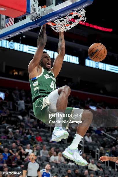 Thanasis Antetokounmpo of the Milwaukee Bucks dunks against the Detroit Pistons during the fourth quarter at Little Caesars Arena on March 27, 2023...