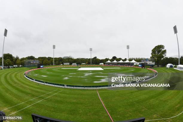 Puddles form on the field as rain falls before the start of the second one-day international cricket match between New Zealand and Sri Lanka at...