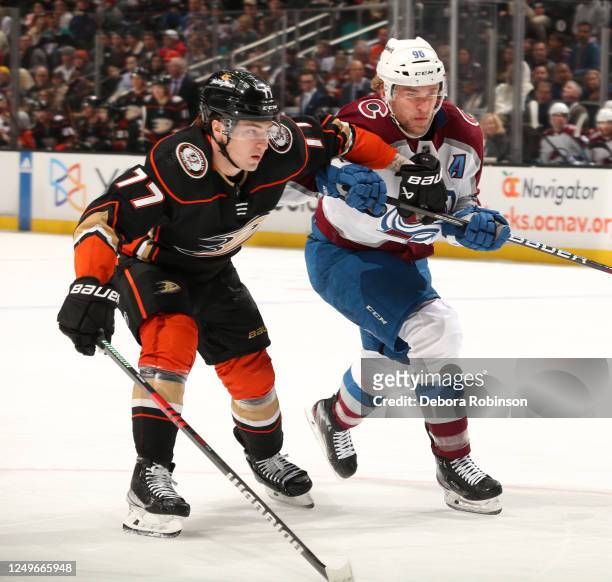 Frank Vatrano of the Anaheim Ducks and Mikko Rantanen of the Colorado Avalanche battle for position during the first period at Honda Center on March...