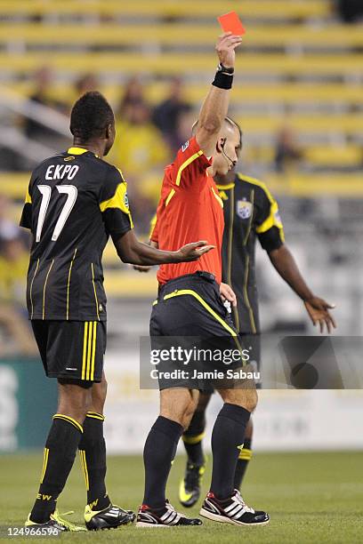 Emmanuel Ekpo of the Columbus Crew is given a red card in the first half against the Houston Dynamo by referee Chris Penso on September 14, 2011 at...