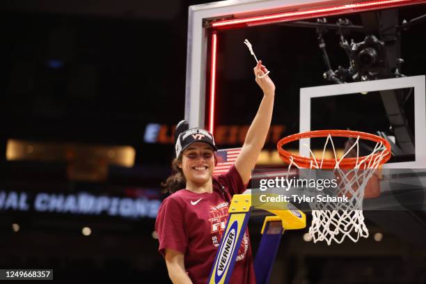 Virginia Tech Hokies guard Georgia Amoore holds up a piece of the net after the game against the Ohio State Buckeyes during the Elite Eight round of...
