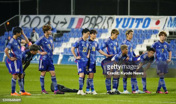 Japan's under-22 football squad react after losing to Belgium 3-2 in an international friendly in Murcia, Spain, on March 27, 2023.